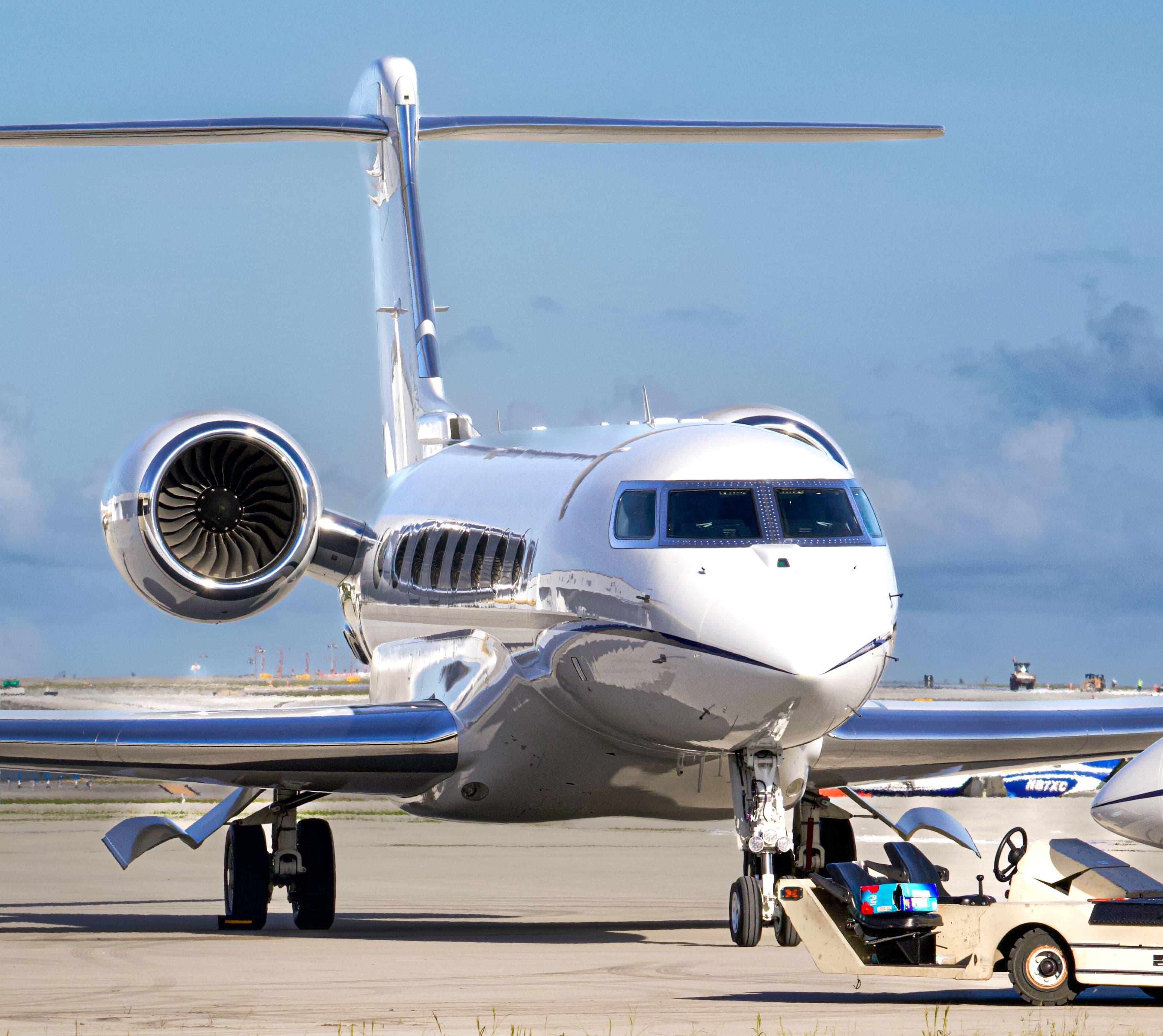 Charter broker reviewing trip details before a private jet departure